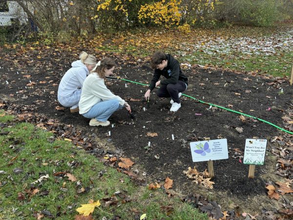 Outdoor Learning Lab students prepare their lab for the cold weather to start again in the spring.