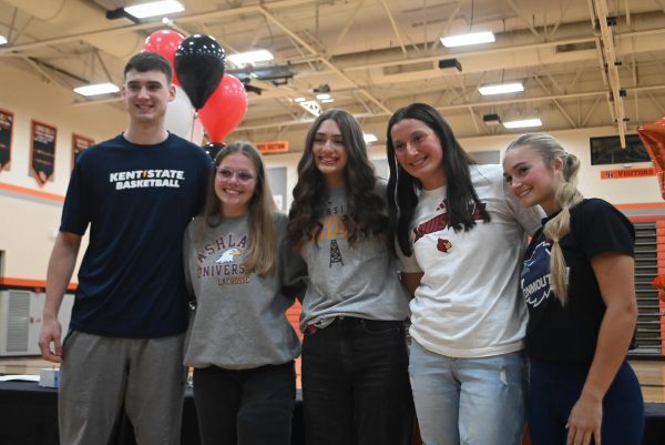 Hayes athletes pose for a picture prior to signing their letters of intent.