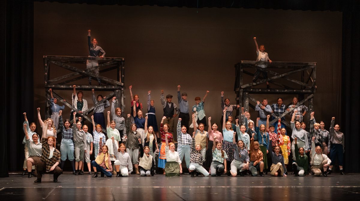 The cast of "Newsies Jr." pose during their dress rehearsal.