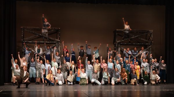 The cast of "Newsies Jr." pose during their dress rehearsal.