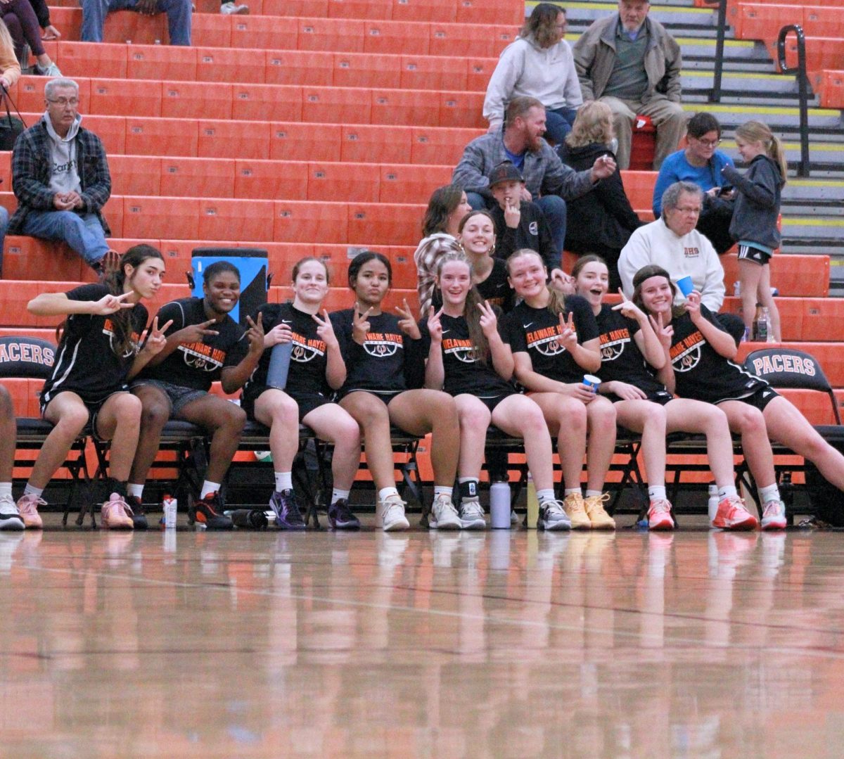 Varsity girls' pose for a team picture after the games.