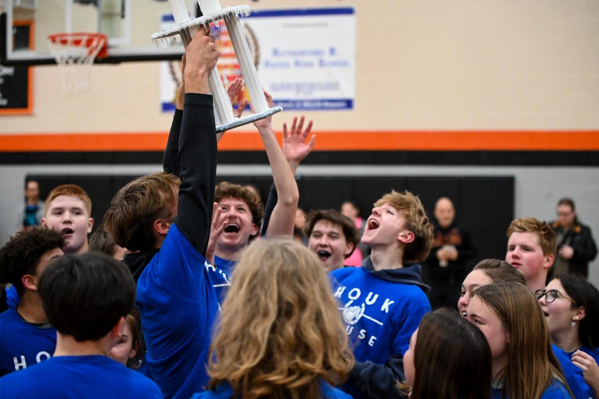 Houk House hoists the trophy for winning the Ice Games.