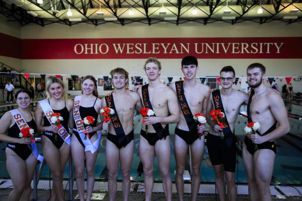 Hayes swim team seniors line up for a group photo following their senior day traditions.