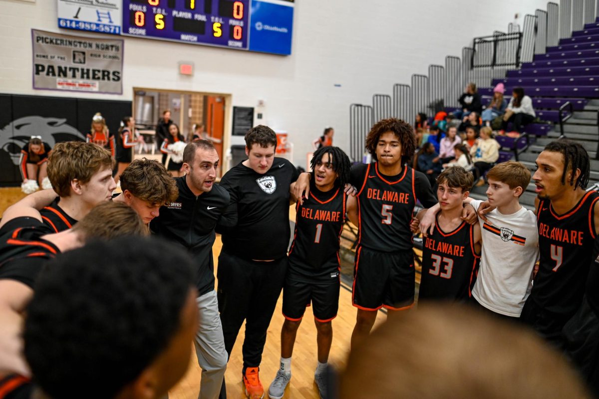 Head Coach Adam Vincenzo talks to his team one last time before the game.