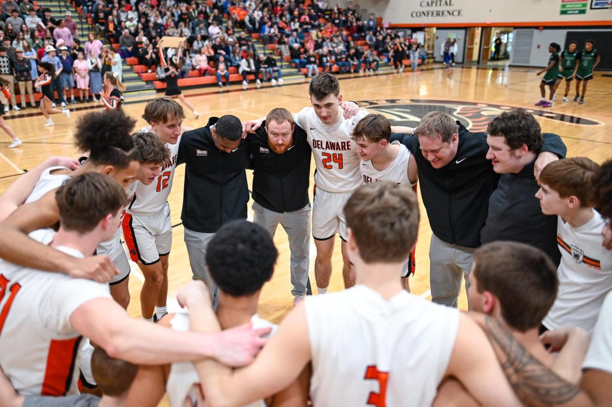 The team huddles together before the start of the game.