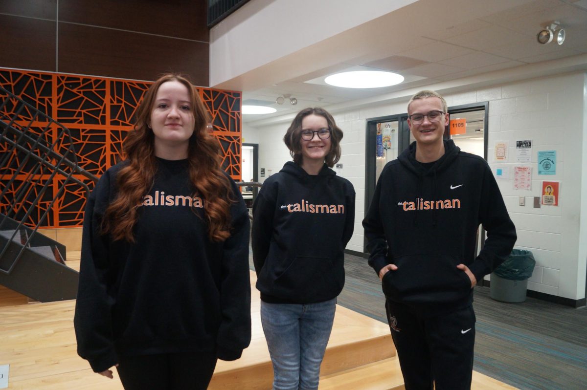 Returning and new Talisman staff members sport merch introduced in the 2024-2025 school year.