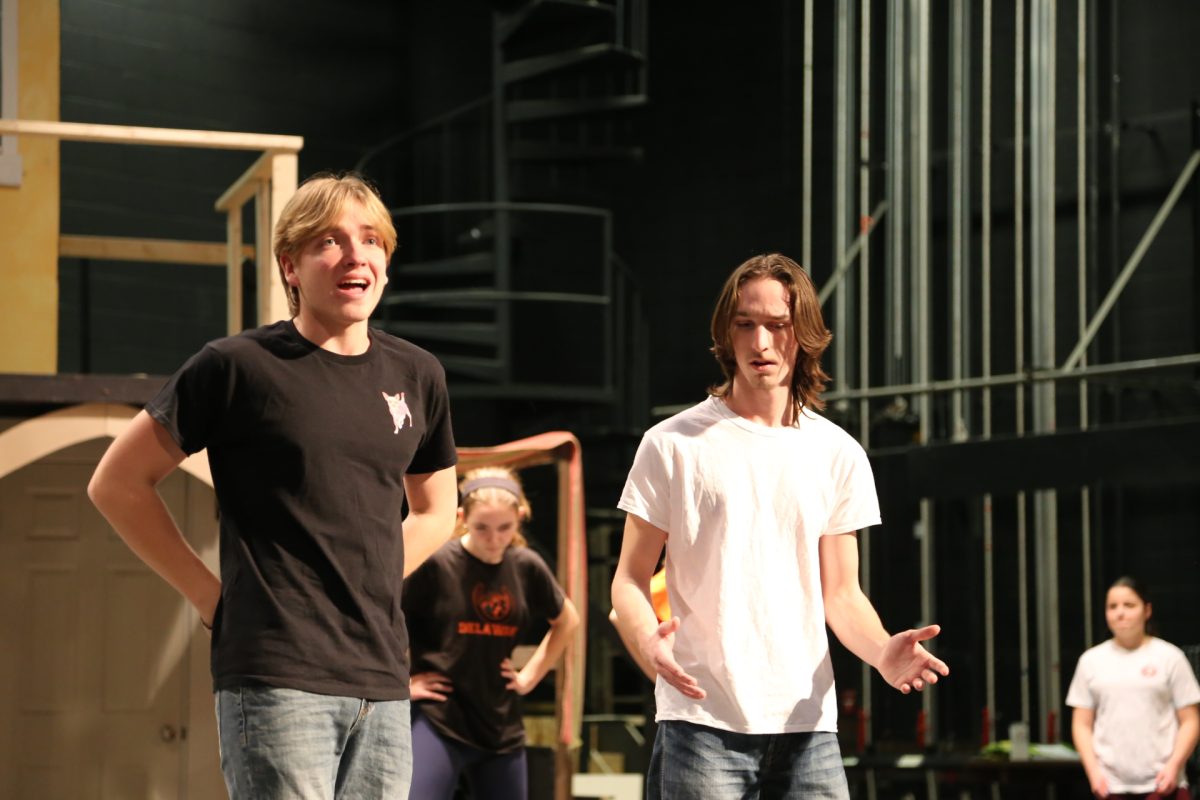 Junior Wyatt Kumpf and Senior Orion Kapp practice their lines for the musical "Something Rotten."