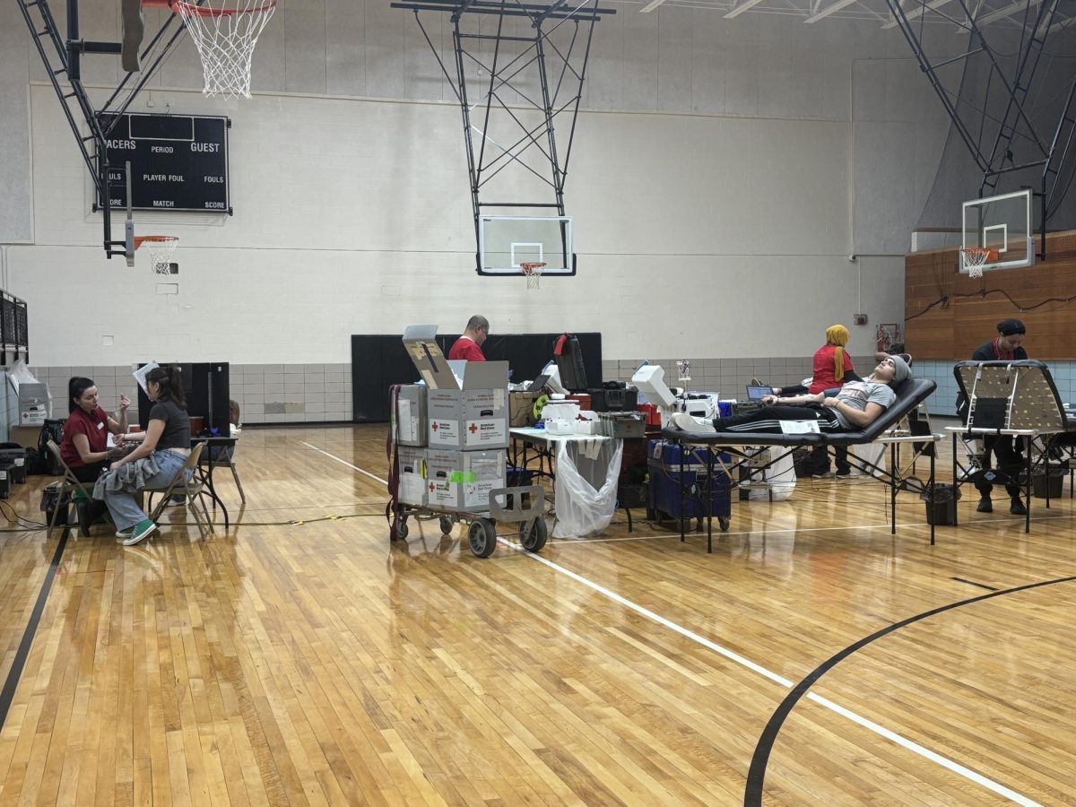 The American Red Cross set up the blood drive in the Hayes auxiliary gym, and students participate in donating blood.