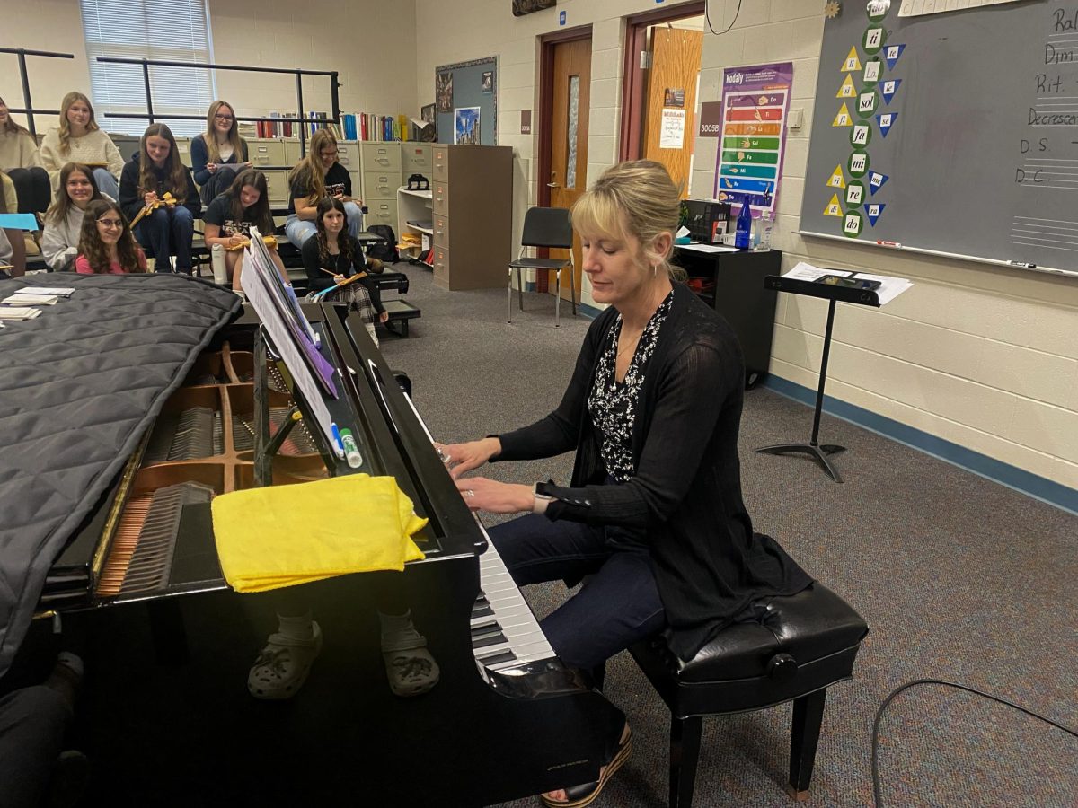 Dara Gillis uses the piano as a medium to help teach her students.
