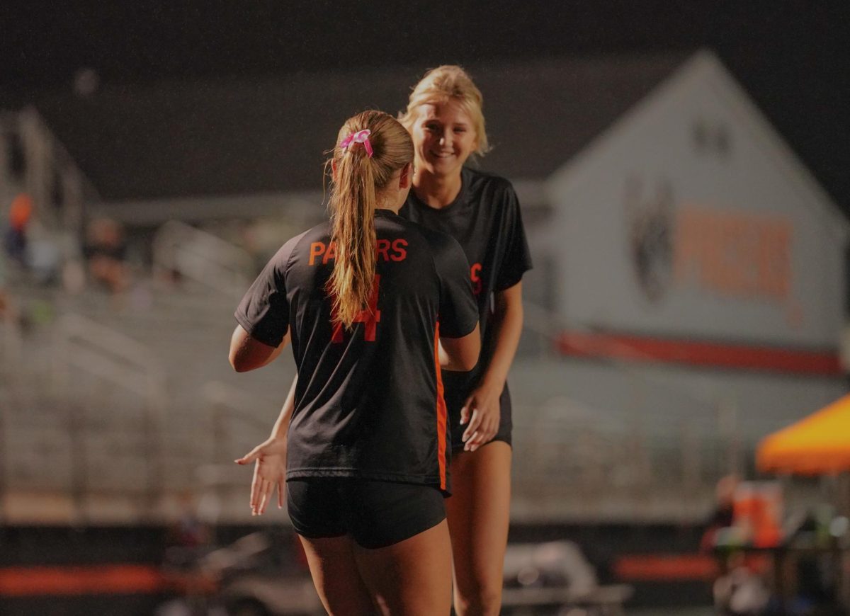 Dye and sophomore Molly Johnson celebrate after Dye's goal.