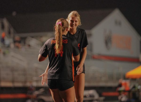 Dye and sophomore Molly Johnson celebrate after Dye's goal.