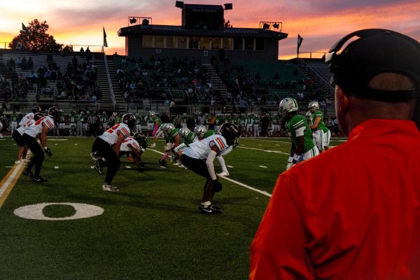 Coach Colt Tanner watches the defense.