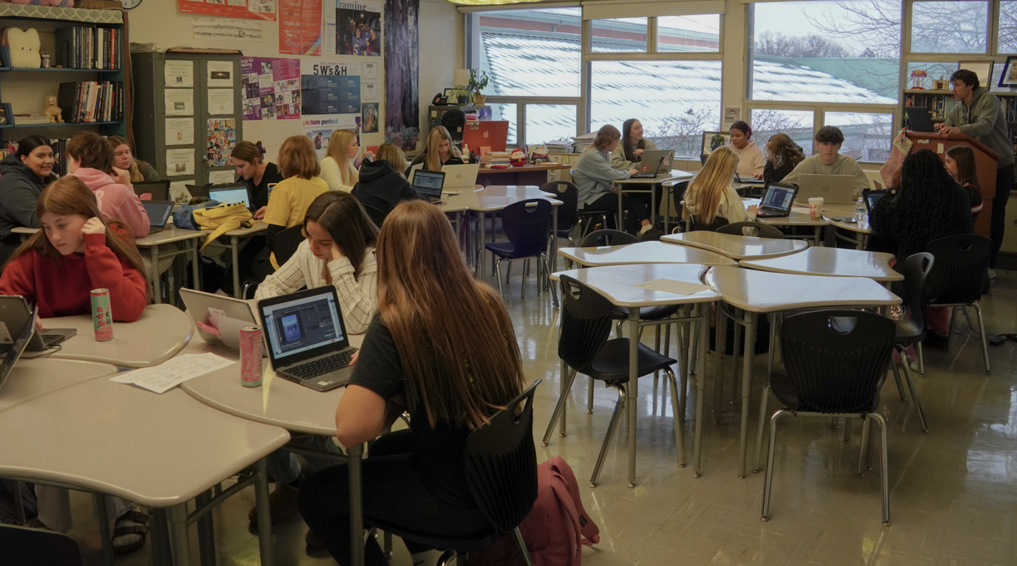 DelHi students work on this year's yearbook. Students can reserve their copy of the 2025-2026 yearbook at yearbookforever.com