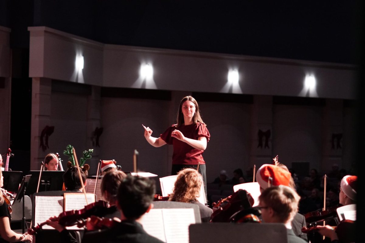 Director Allison Parrett conducts her orchestra.