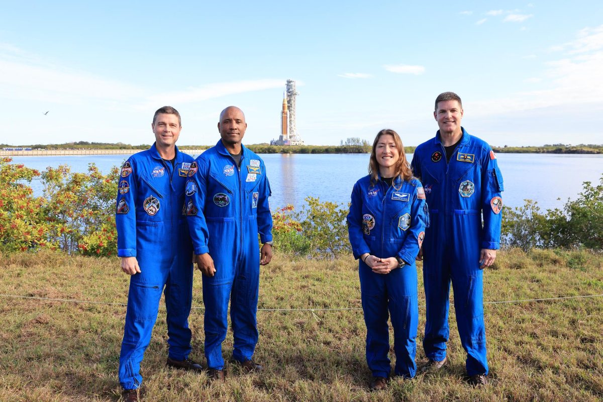 From left to right, Artemis II NASA astronauts Reid Wiseman, commander; Victor Glover, pilot, and Christina Koch, mission specialist, and CSA (Canadian Space Agency) Jeremy Hansen, mission specialist, pose for a photograph during rollout of NASA’s Artemis II SLS (Space Launch System) rocket and Orion spacecraft to Launch Complex 39B at NASA’s Kennedy Space Center in Florida on Saturday, Jan. 17, 2026. In the coming weeks, engineers will prepare for the wet dress rehearsal, a two-day test that simulates launch day. The Artemis II test flight will take Commander Reid Wiseman, Pilot Victor Glover, and Mission Specialist Christina Koch from NASA, and Mission Specialist Jeremy Hansen from the CSA (Canadian Space Agency), around the Moon and back to Earth no later than April 2026.