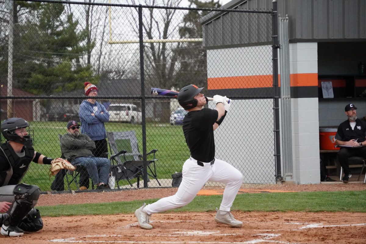 Sophomore Austin Lukacsko gets a hit down towards deep right center.