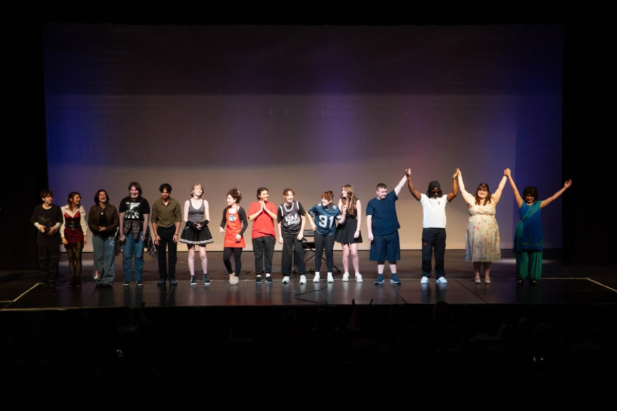 Participants thank the crowd after their show.